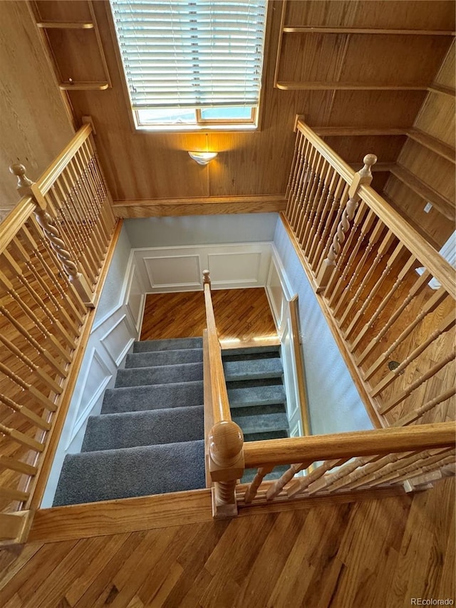 stairway featuring hardwood / wood-style flooring