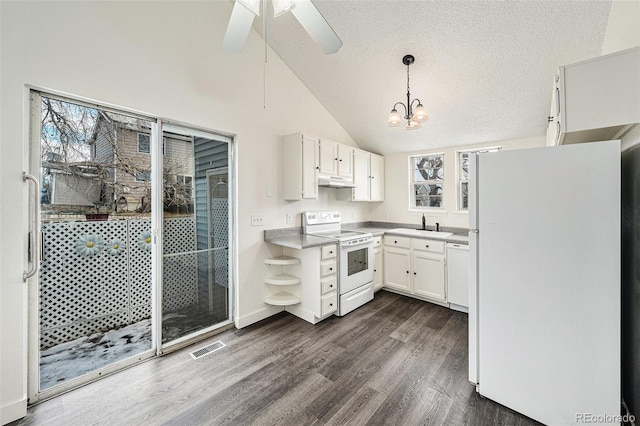 kitchen featuring pendant lighting, high vaulted ceiling, white cabinetry, dark hardwood / wood-style flooring, and white appliances