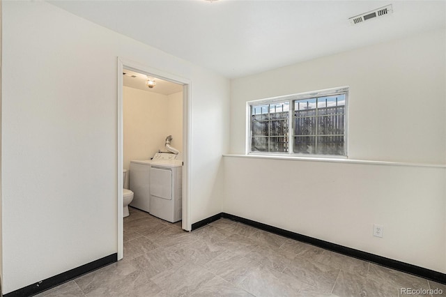 interior space with washing machine and dryer