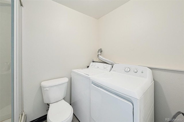 washroom featuring washer and clothes dryer