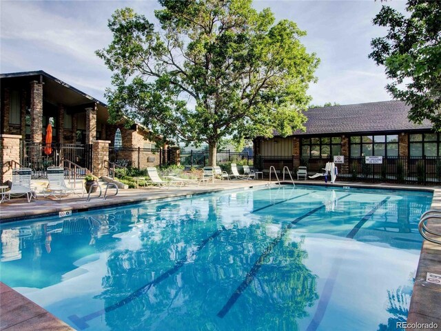 3022 S Wheeling Way Unit 407, Aurora, CO 80014 - pool featuring a patio and fence