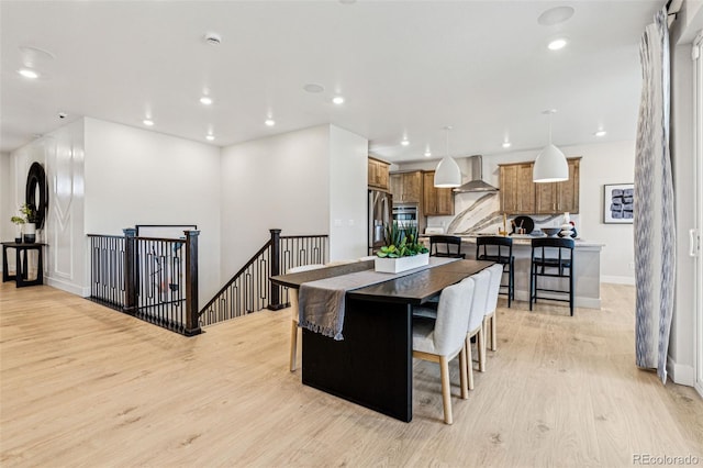 17146 W 92nd Loop, Arvada, CO 80007 - dining space with light wood-style floors, recessed lighting, and baseboards
