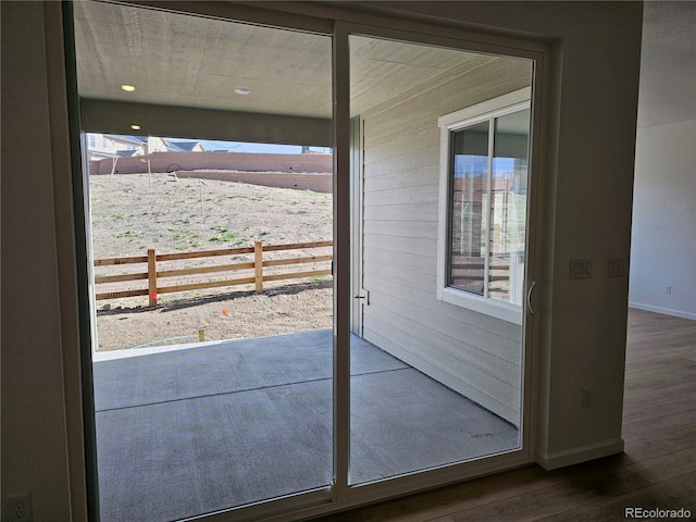 17146 W 92nd Loop, Arvada, CO 80007 - doorway with baseboards and dark wood finished floors