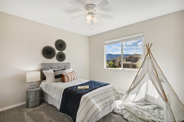 bedroom featuring carpet floors, baseboards, and a ceiling fan