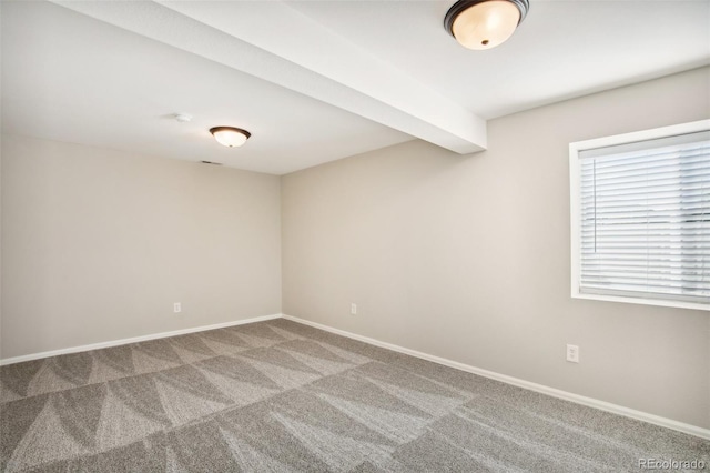 spare room with carpet floors and baseboards