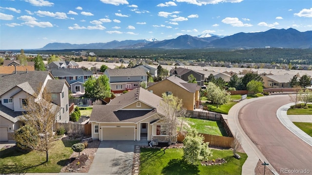aerial view of residential area with a mountain backdrop