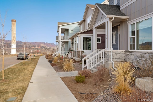 view of property exterior with a mountain view