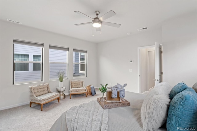 living area featuring ceiling fan and carpet