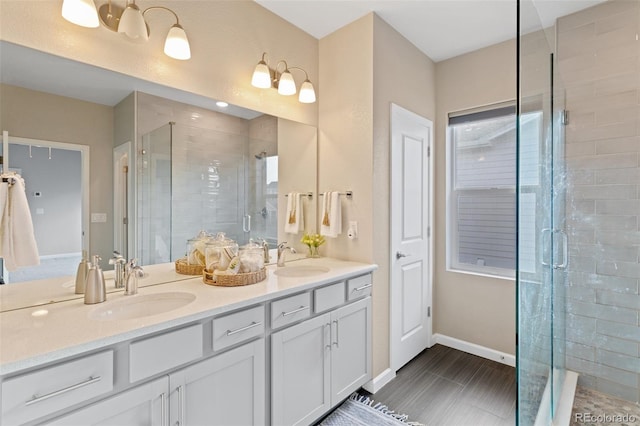 bathroom with vanity and walk in shower