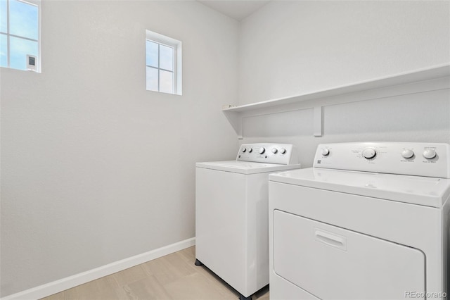 laundry area with washing machine and clothes dryer