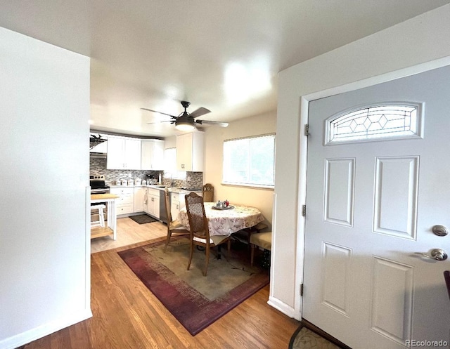 2285 S Knox Ct, Denver, CO 80219 - dining space with light wood-style flooring and ceiling fan