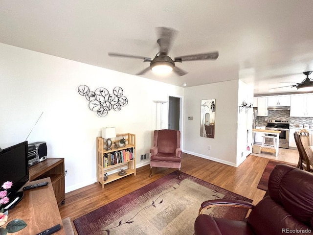 2285 S Knox Ct, Denver, CO 80219 - living room featuring a ceiling fan and wood finished floors