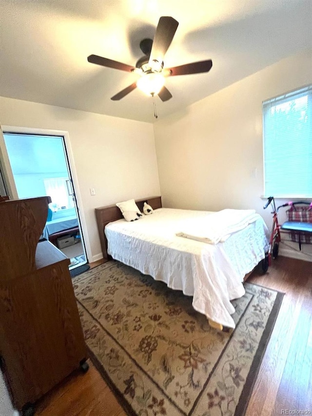 2285 S Knox Ct, Denver, CO 80219 - bedroom featuring dark wood-style floors and a ceiling fan