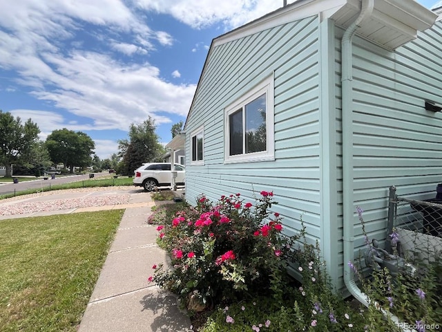 2285 S Knox Ct, Denver, CO 80219 - view of property exterior featuring a yard