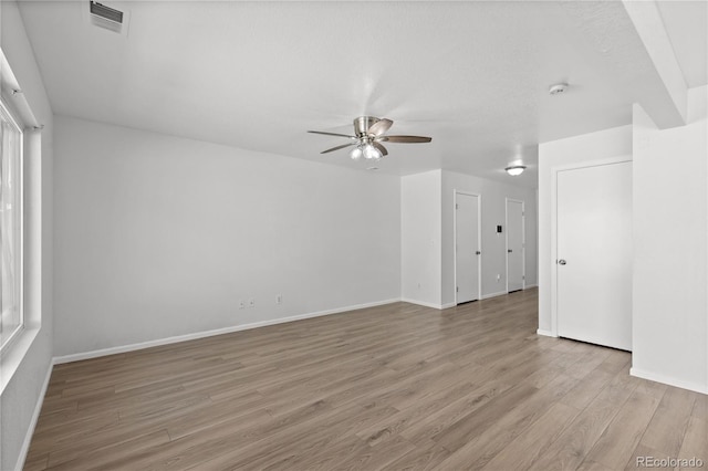 19817 E 47th Pl, Denver, CO 80249 - empty room featuring a ceiling fan, light wood-type flooring, and baseboards