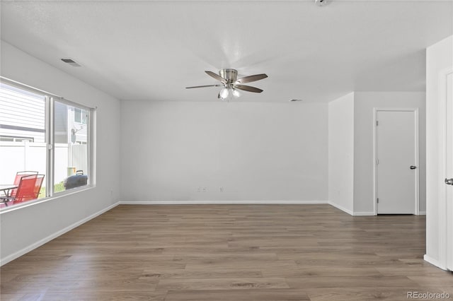 19817 E 47th Pl, Denver, CO 80249 - unfurnished room featuring ceiling fan, wood finished floors, and baseboards