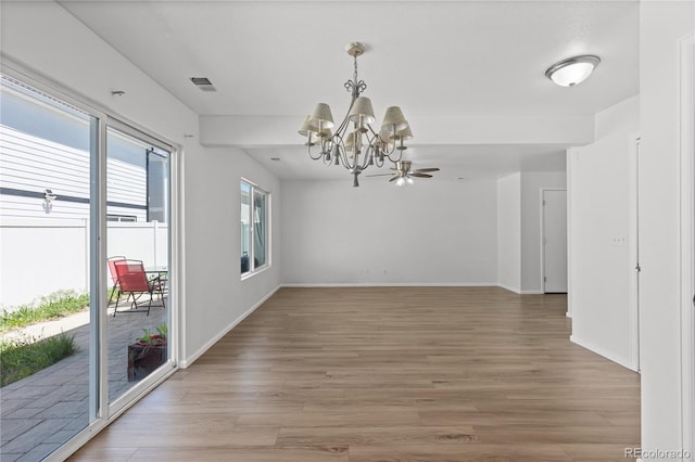 19817 E 47th Pl, Denver, CO 80249 - unfurnished dining area featuring a chandelier, light wood finished floors, and baseboards