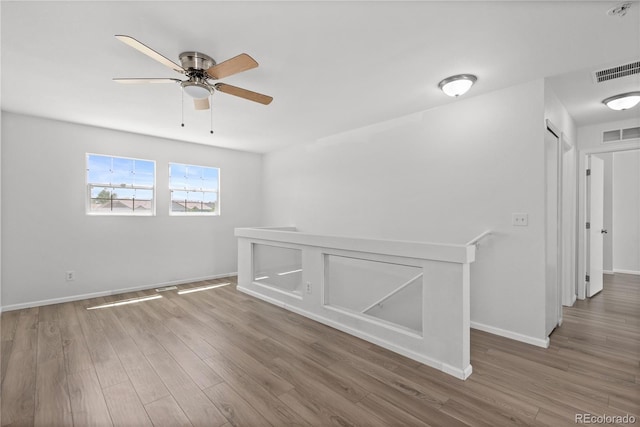 19817 E 47th Pl, Denver, CO 80249 - unfurnished room featuring wood finished floors, ceiling fan, baseboards, and a smoke detector