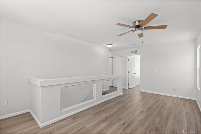 19817 E 47th Pl, Denver, CO 80249 - unfurnished room featuring ceiling fan, wood finished floors, and baseboards