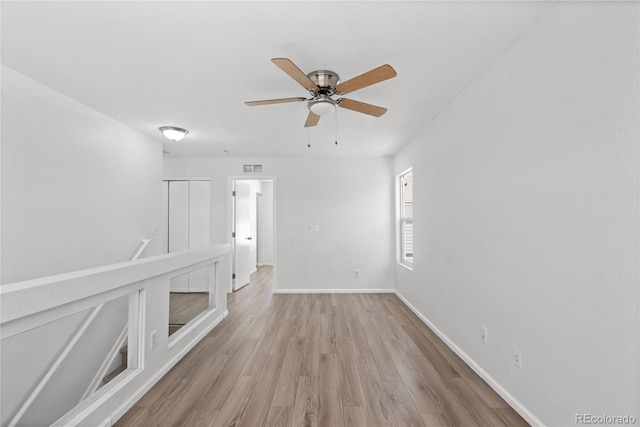 19817 E 47th Pl, Denver, CO 80249 - unfurnished room with wood finished floors, a ceiling fan, and baseboards