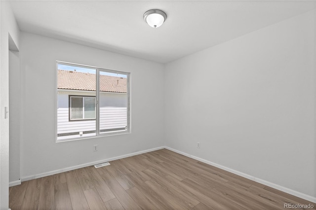 19817 E 47th Pl, Denver, CO 80249 - spare room with wood finished floors and baseboards