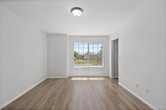 19817 E 47th Pl, Denver, CO 80249 - spare room featuring wood finished floors and baseboards