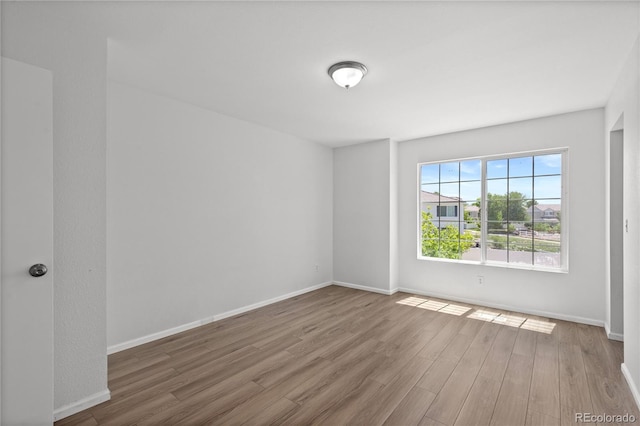 19817 E 47th Pl, Denver, CO 80249 - empty room featuring wood finished floors and baseboards