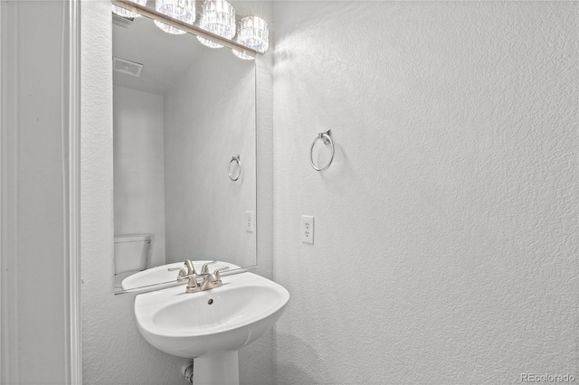 19817 E 47th Pl, Denver, CO 80249 - bathroom with a sink and a textured wall