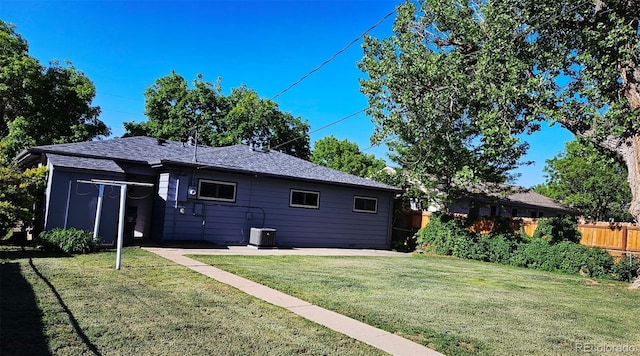5567 E Asbury Ave, Denver, CO 80222 - rear view of house with a patio area, central air condition unit, and roof with shingles