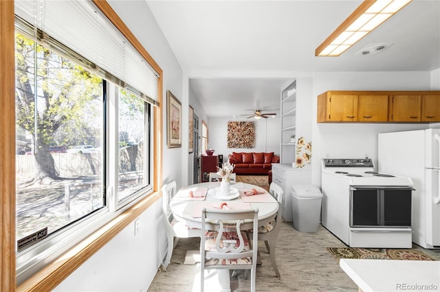 5567 E Asbury Ave, Denver, CO 80222 - kitchen with white appliances, a ceiling fan, light countertops, and brown cabinets