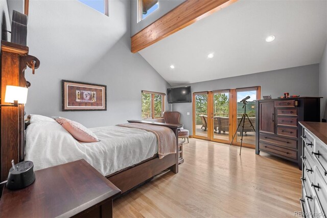 bedroom featuring access to outside, light wood-style flooring, beam ceiling, and high vaulted ceiling
