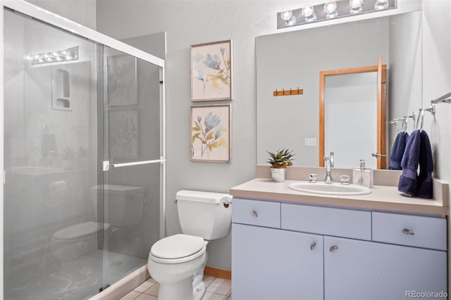 full bathroom featuring vanity, tile patterned floors, toilet, and a shower stall