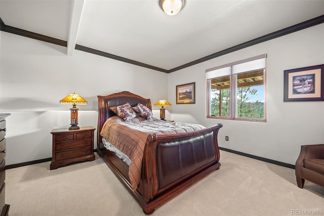 bedroom featuring crown molding, baseboards, and light colored carpet