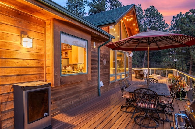 wooden deck with outdoor dining area