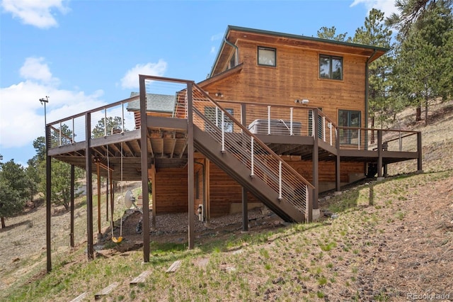 back of property with a deck