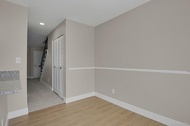 spare room with light wood-type flooring