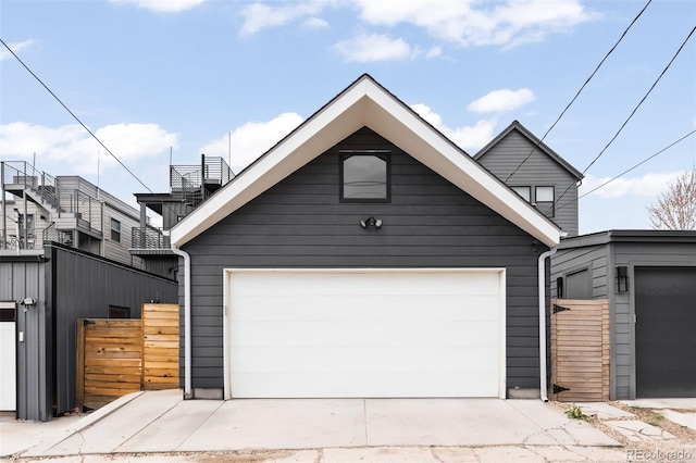 garage with a gate and fence