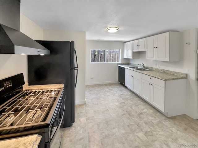 438 S 7th Ave, Brighton, CO 80601 - kitchen featuring gas stove, wall chimney exhaust hood, white cabinetry, and light countertops