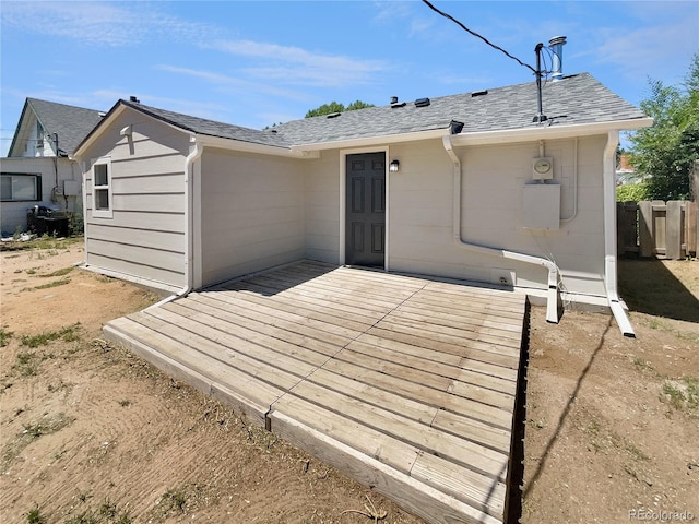 438 S 7th Ave, Brighton, CO 80601 - back of house with a deck and roof with shingles