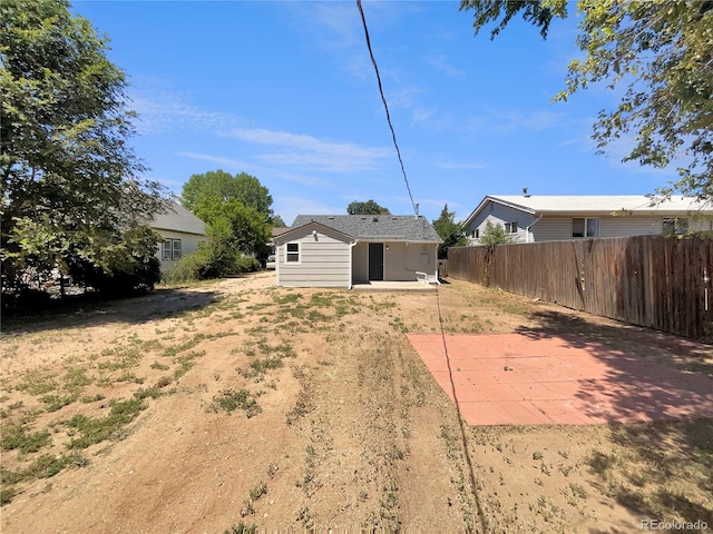 438 S 7th Ave, Brighton, CO 80601 - view of yard featuring a patio and an outbuilding