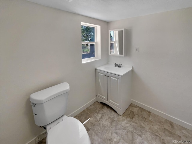 438 S 7th Ave, Brighton, CO 80601 - half bath featuring vanity and baseboards