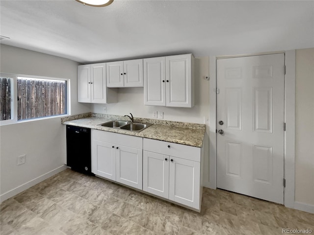 438 S 7th Ave, Brighton, CO 80601 - kitchen with black dishwasher and white cabinetry
