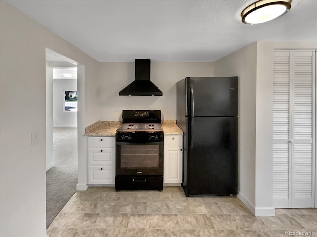 438 S 7th Ave, Brighton, CO 80601 - kitchen with black appliances, wall chimney range hood, white cabinetry, and light stone counters