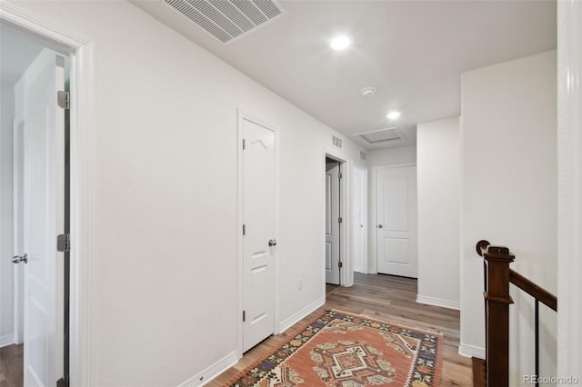 16188 Elizabeth St, Thornton, CO 80602 - corridor with wood finished floors, attic access, an upstairs landing, and recessed lighting