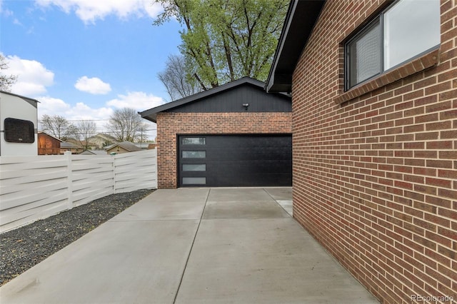 4580 Garland St, Wheat Ridge, CO 80033 - garage with driveway and fence