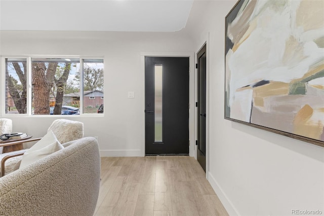 4580 Garland St, Wheat Ridge, CO 80033 - entryway with light wood finished floors and baseboards