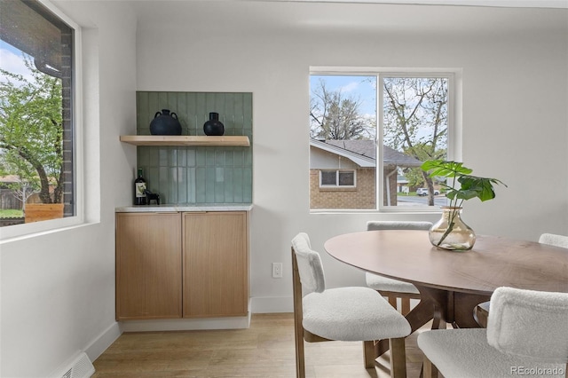4580 Garland St, Wheat Ridge, CO 80033 - dining area with light wood-type flooring and baseboards