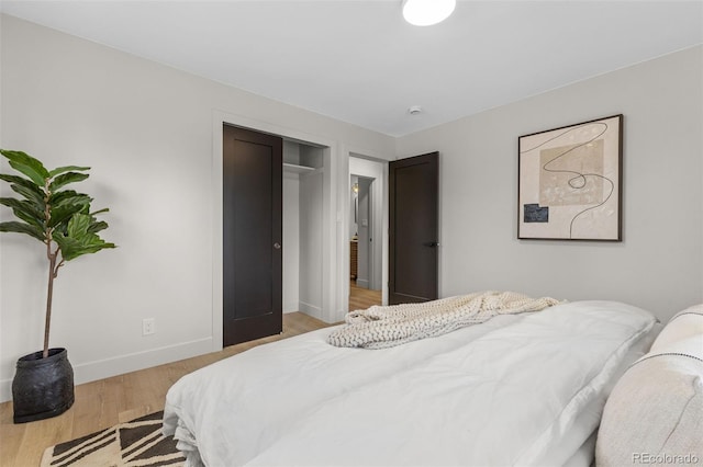 4580 Garland St, Wheat Ridge, CO 80033 - bedroom with baseboards, light wood-style floors, and a closet