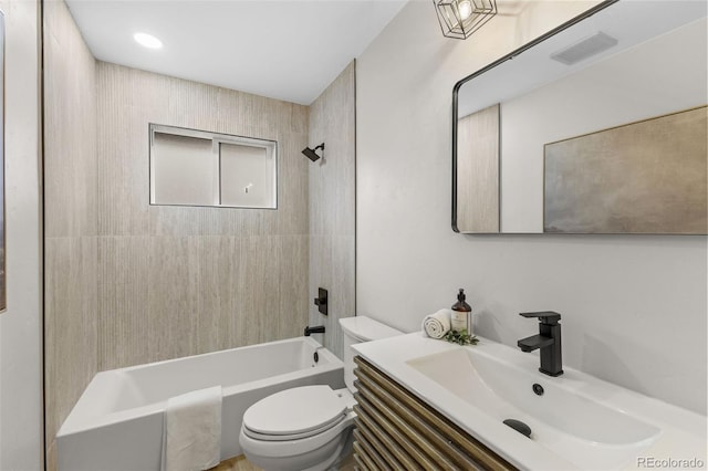 4580 Garland St, Wheat Ridge, CO 80033 - bathroom featuring toilet, shower / washtub combination, and vanity