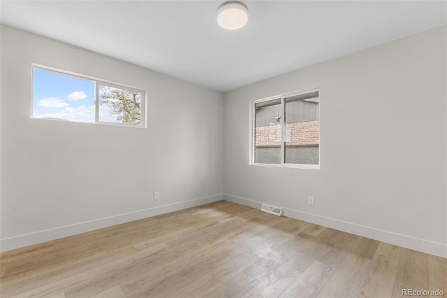 4580 Garland St, Wheat Ridge, CO 80033 - unfurnished room featuring baseboards and light wood-style flooring